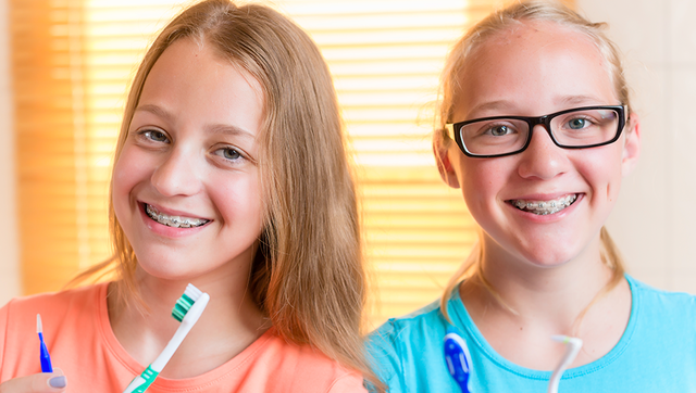 Two young patients wear braces for kids